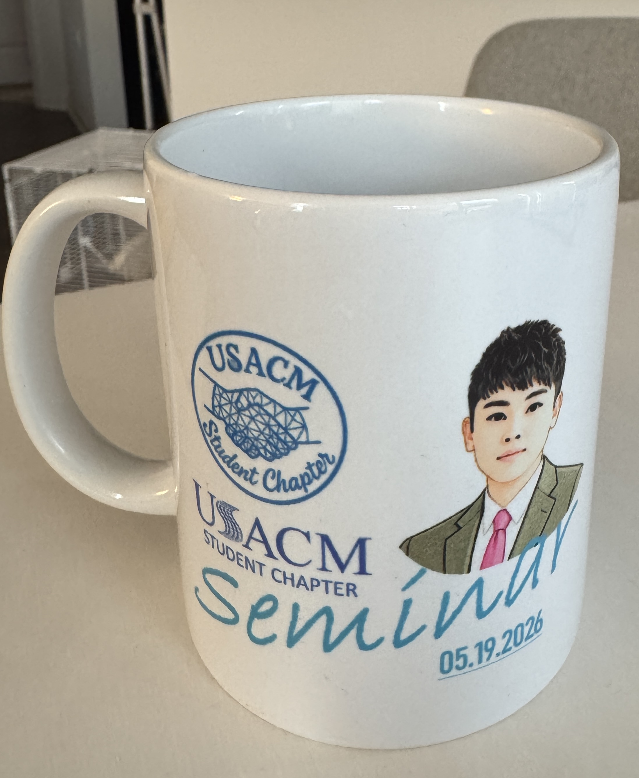 Custom mug gift from USACM Student Chapter with seminar date 05.19.2026